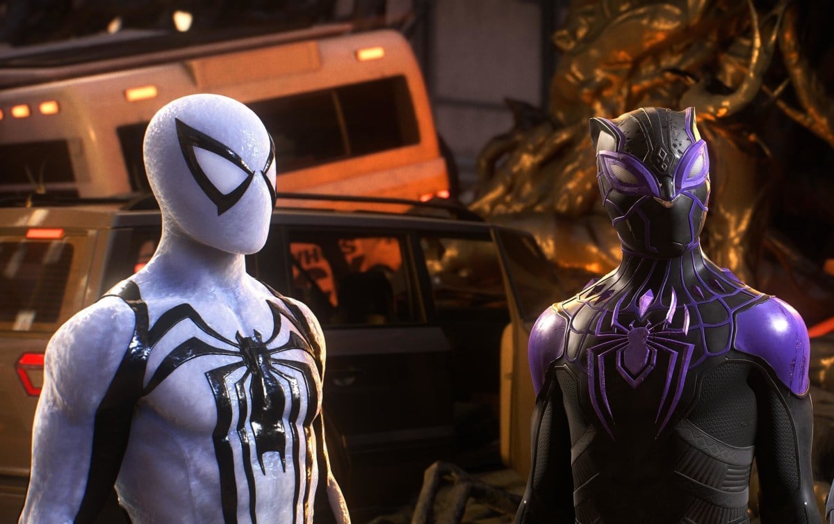 Peter Parker in the Anti-Venom suit stands alongside Miles Morales in the Forever Suit in Spider-Man 2.