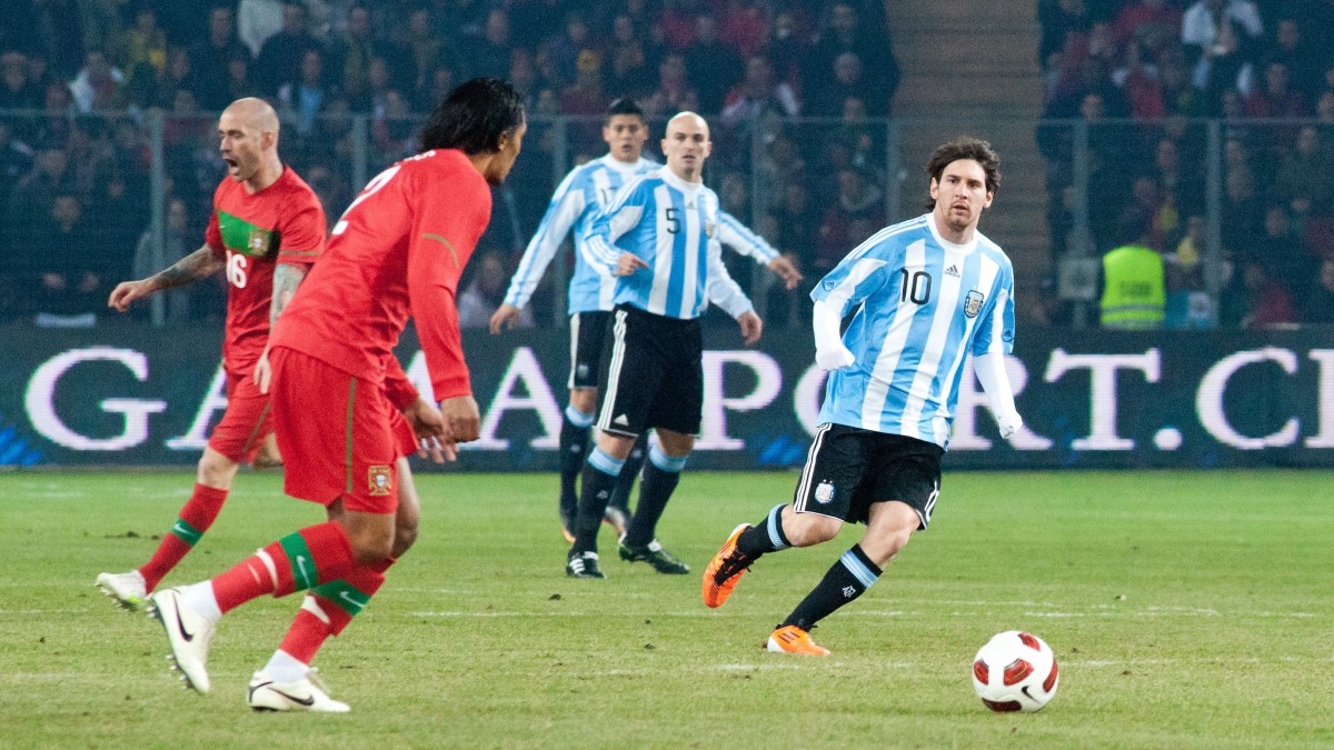 Lionel Messi controls the ball during an Argentina vs. Portugal match in 2011.