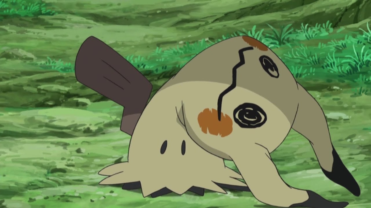 Mimikyu sitting on a patch of grass