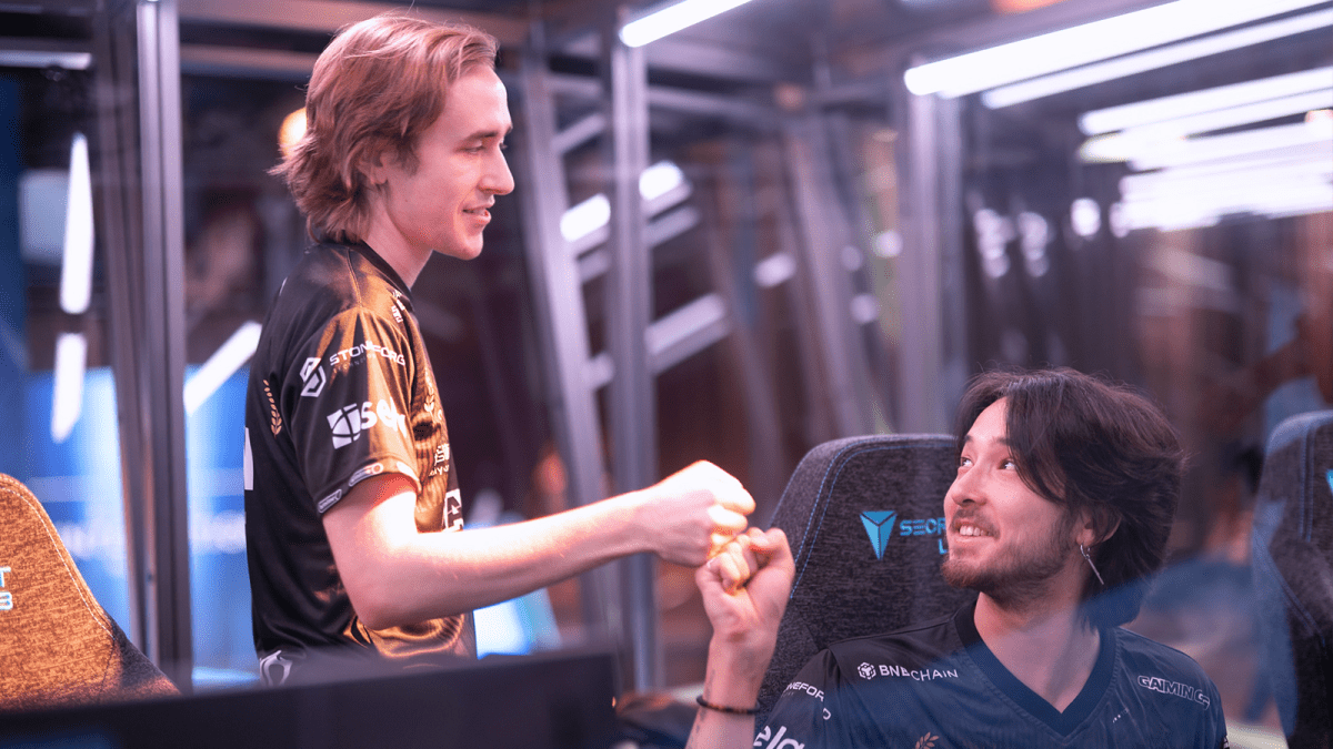 Quinn and tOfu celebrating a TI12 win.