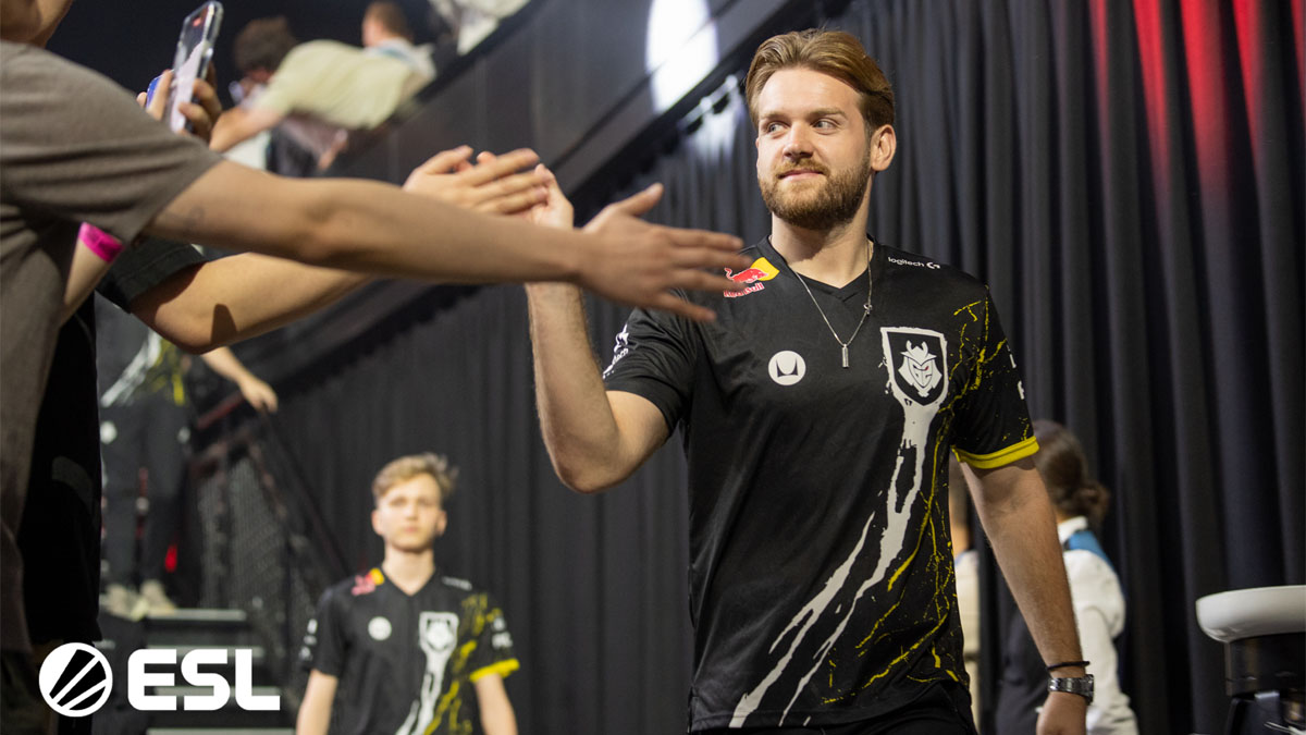 NiKo, a player for G2, high-fives fans at IEM Sydney, a CS2 tournament.