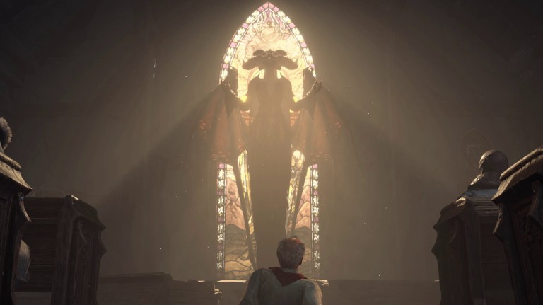 A man praying at a Lilith statue in Diablo 4