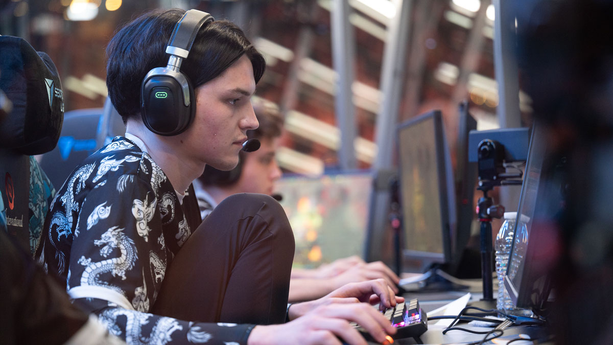 A Team Spirit player sits in their chair in the booth at TI 2023.