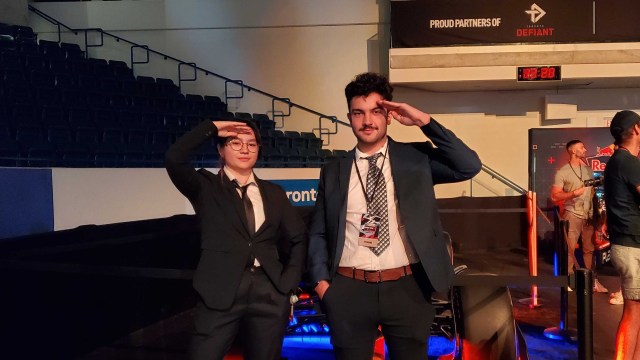 Two fans salute the end of the Overwatch League live at the Grand Finals.