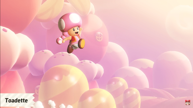 Toadette jumping in the air with a pink sky in the background in Mario Wonder.