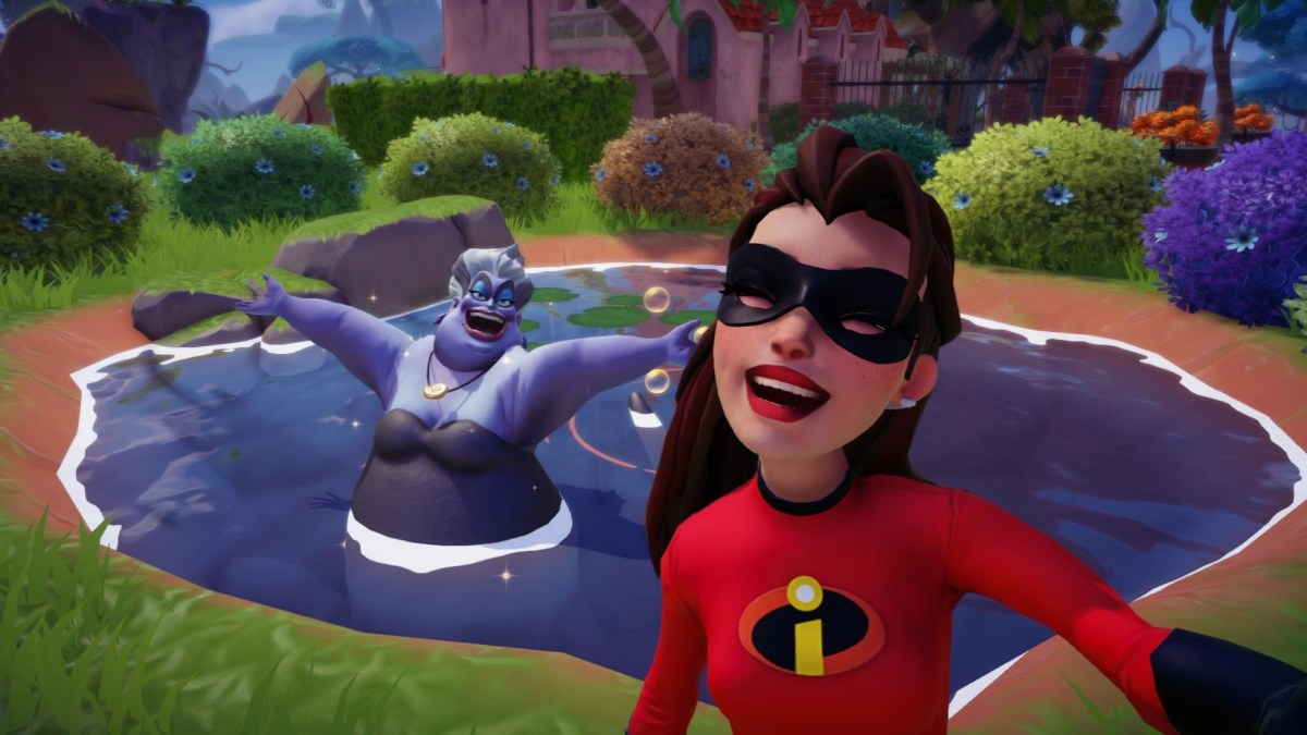 The player wearing an Incredibles mask while taking a selfie with Ursula.