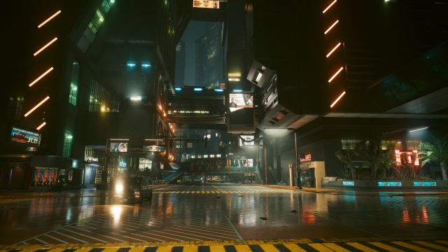 Cyberpunk 2077's Night City on a rainy night with beautiful reflections on the pavement.