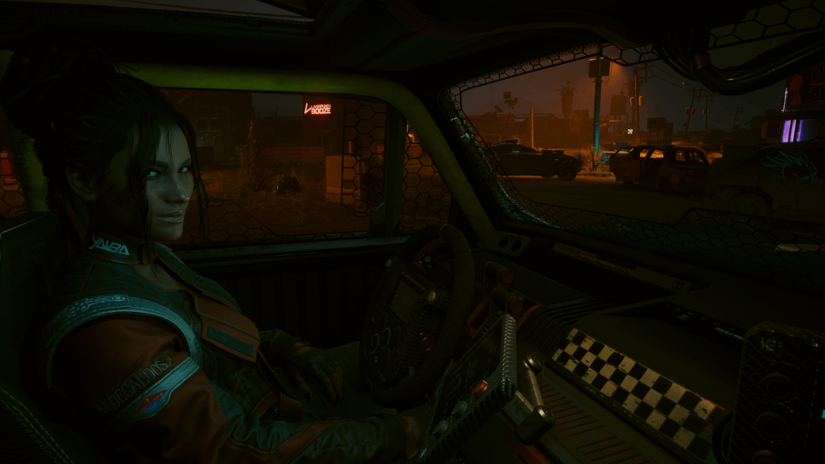 Panam, a nomad woman in a leather jacket,smiling at V in a car (Cyberpunk 2077)