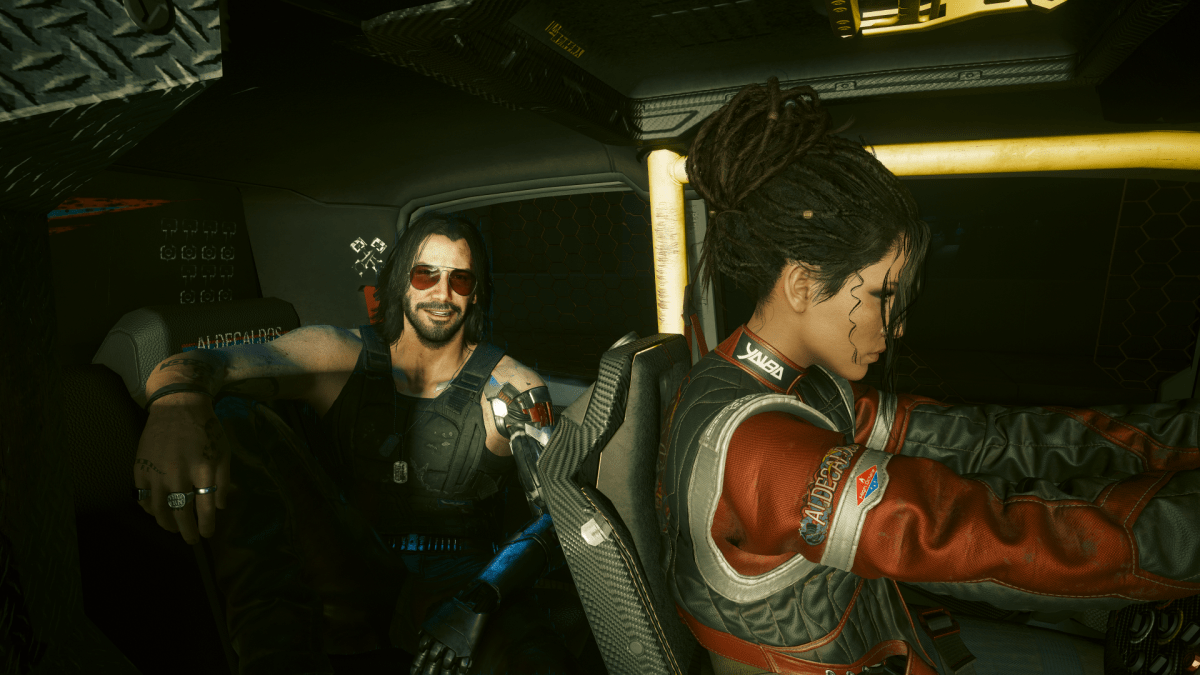 Panam and Johnny sitting in Panam's truck in Cyberpunk 2077