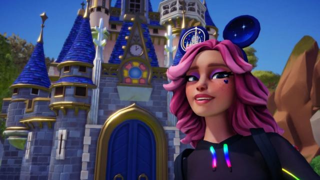 The player wearing Touch of Magic ears and taking a selfie in front of a castle in Disney Dreamlight Valley.