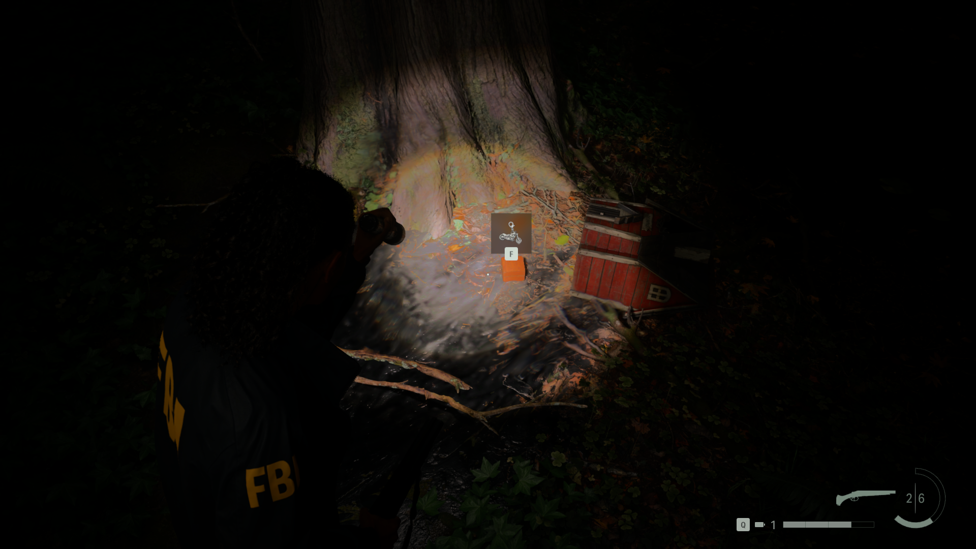 A charm sitting at the base of a tree in Alan Wake 2.