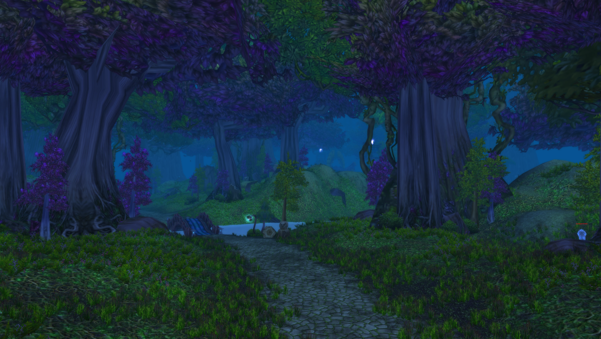 A WoW screenshot featuring the main road that runs through the entirety of Ashenvale, along with some trees and lush forests propping up the background of the image