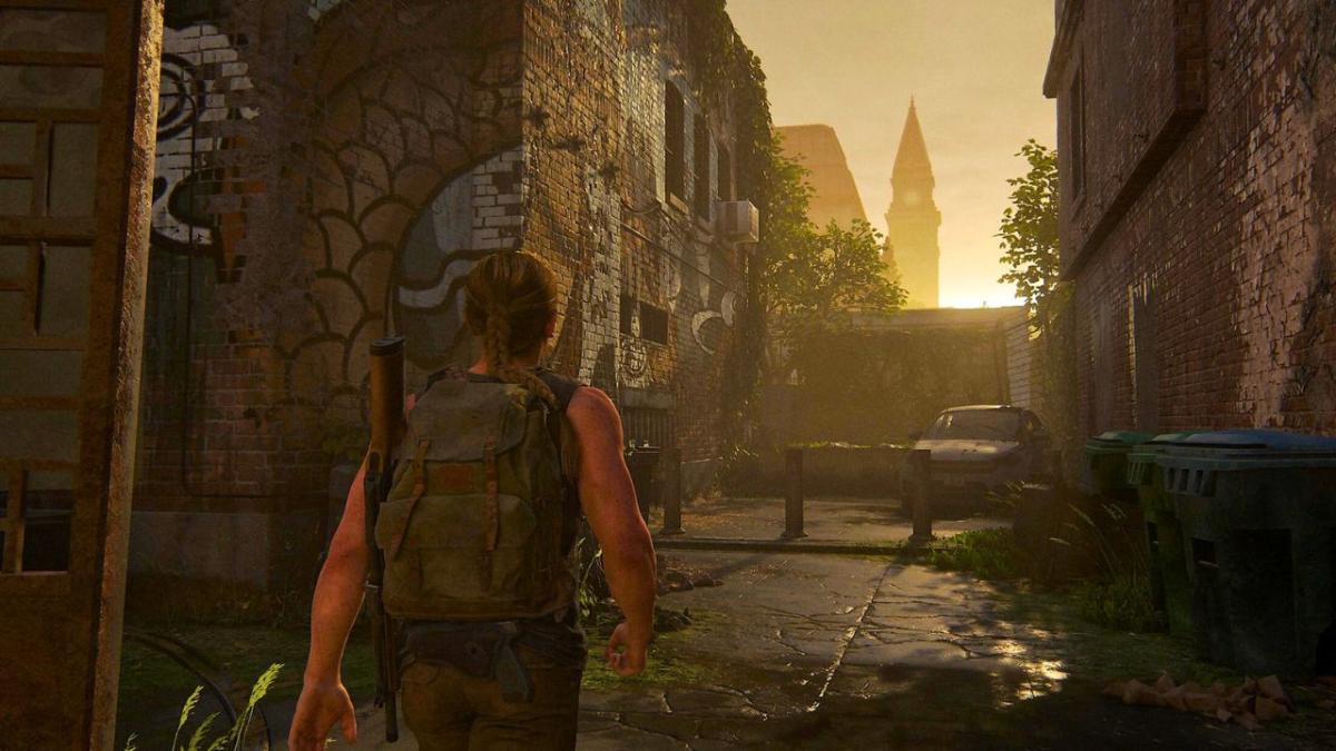 A girl walking in a graffitti alley in The Last of Us 2 remastered