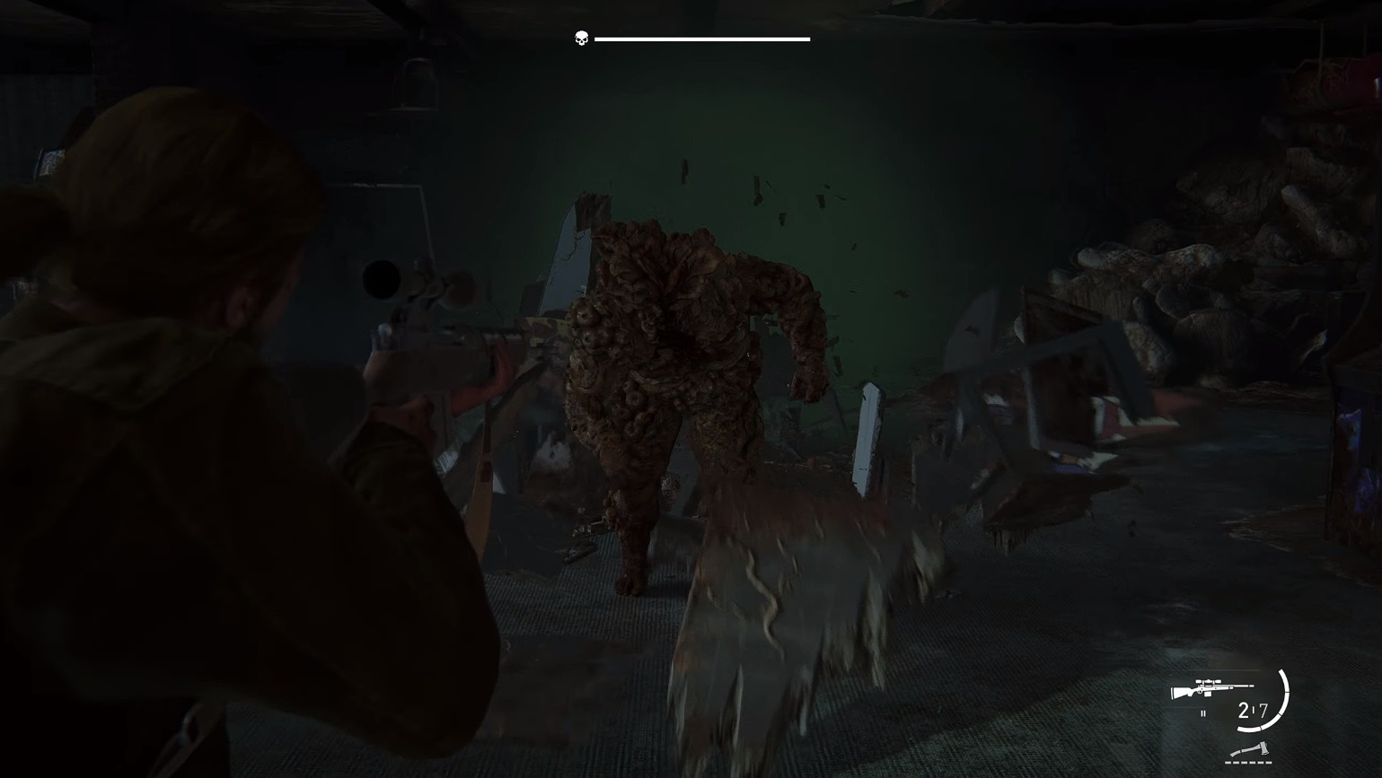 There is a shot of an infected enemy breaking through a wall.