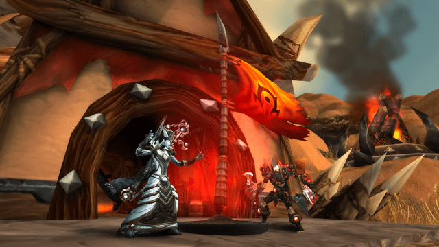 Two WoW players battling it out in Warsong Gulch for the flag
