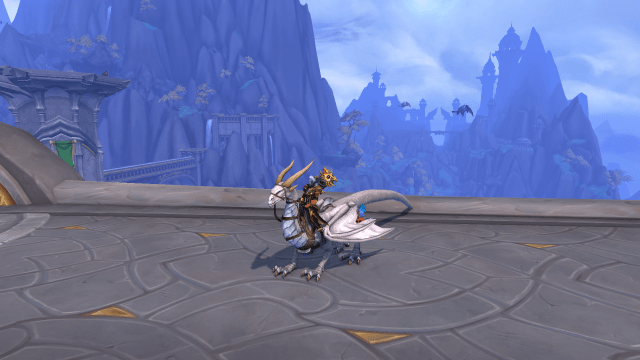 WoW character riding a white Dragonriding drake