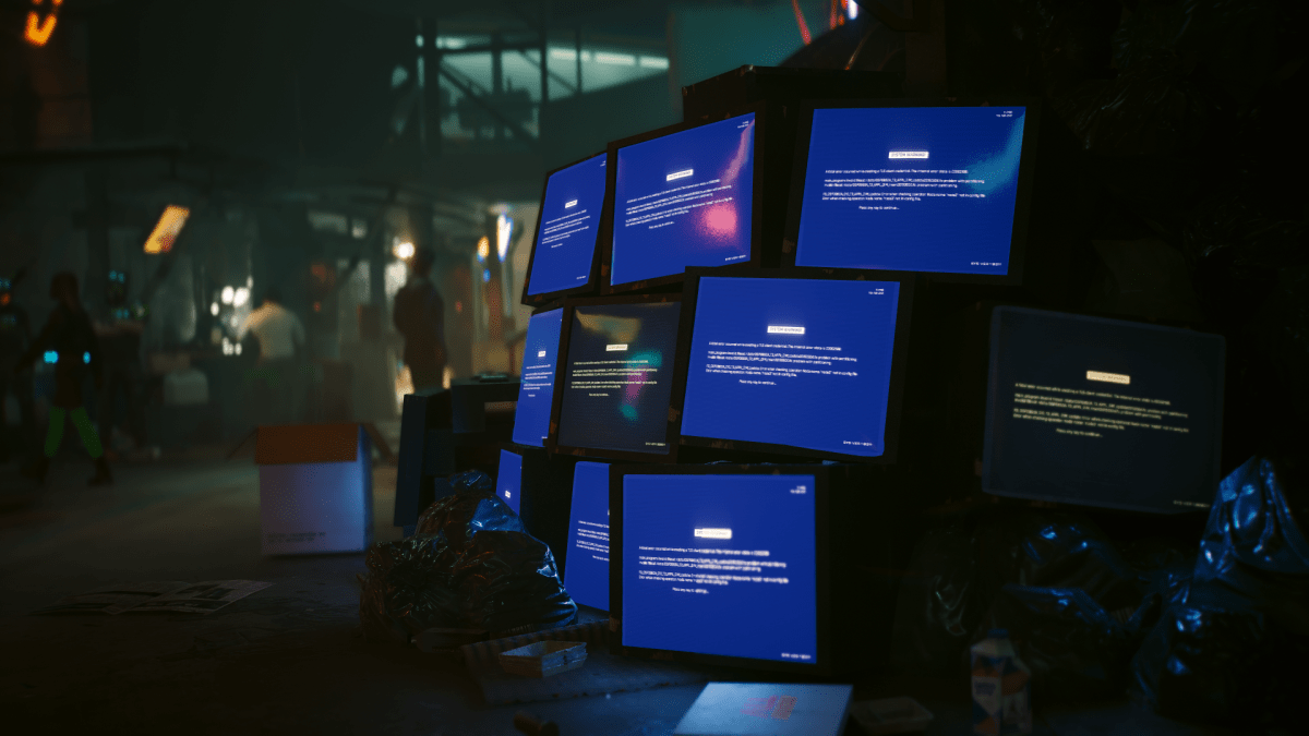 A pile of bluescreened computer monitors in Cyberpunk 2077