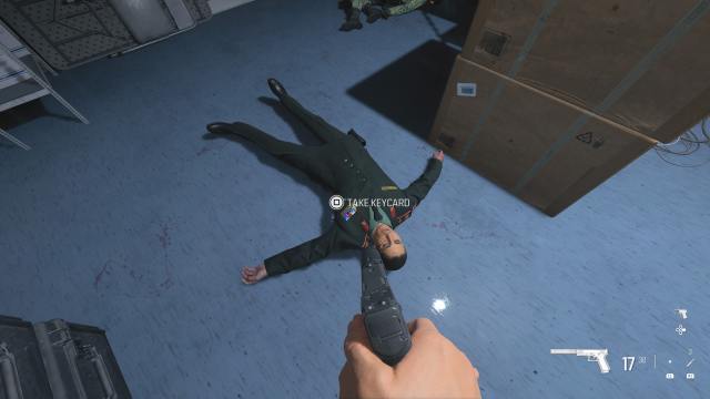 A screenshot of the dead officer and his keycard in the MW3 campaign mission Deep Cover.