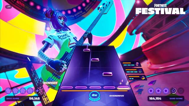 Fortnite Festival gameplay, with the tab and a girl playing an electric guitar.