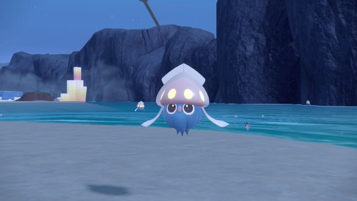 The Pokémon Inkay floats happily above the sand in Pokémon Scarlet and Violet.