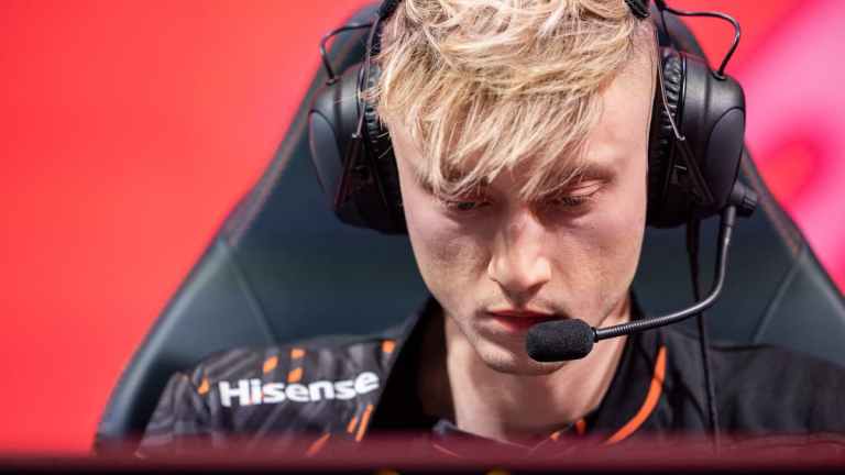 Photo taken of League of Legends pro Rekkles during a LEC match in 2023. He has short blonde hair and is staring at his monitor with headsets on.