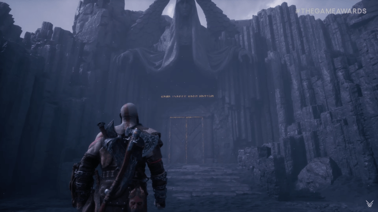 Kratos walking towards a monolithic gate in God of War Ragnarok Valhalla