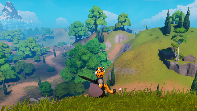 A LEGO Fortnite player equipped with a shield looking at the landscape.