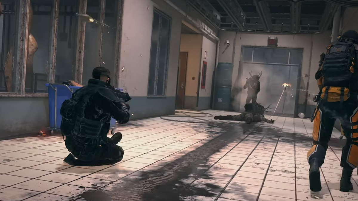 A player slides in a hallway, dodging an RPG and a Sentry Gun on Meat in MW3.