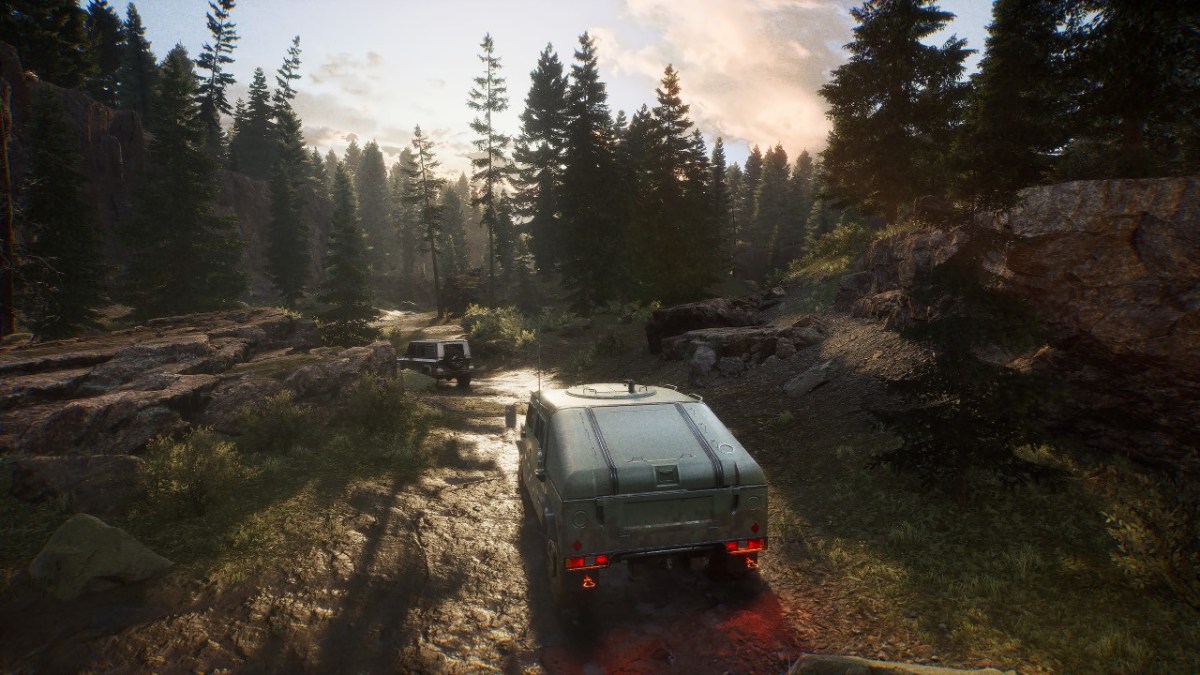 A truck moves towards the forest in The Day Before, depicting a rocky scenery.