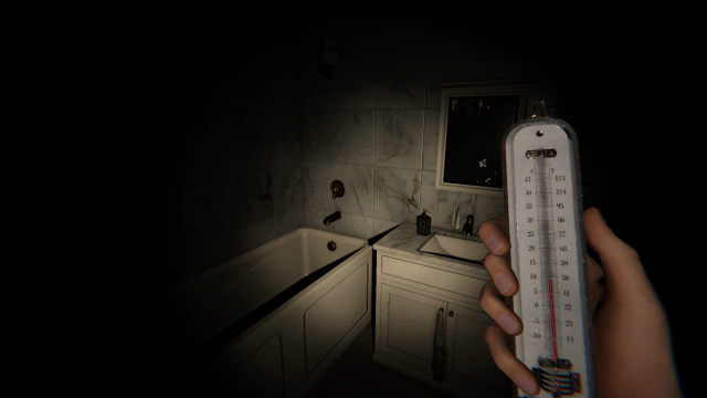 The player using the Thermometer to track down the ghost room.