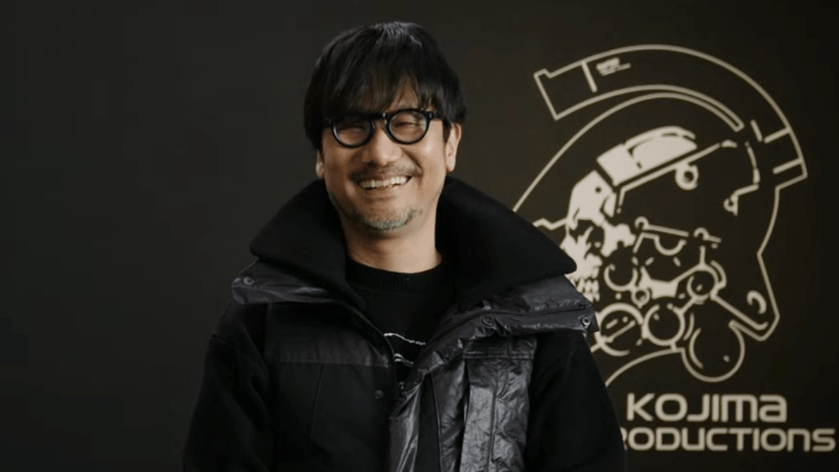 Hideo Kojima smiling at the camera.