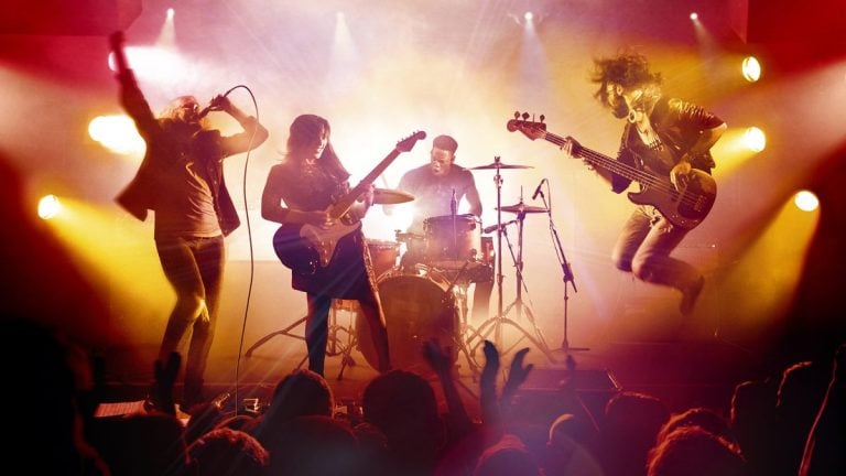 Rock Band 4 keyart of band on stage