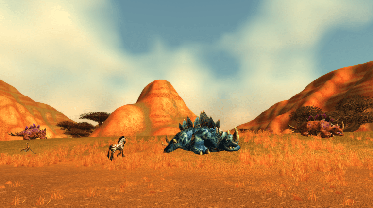 Animals in the fields of the Barrens in WoW Classic. Kodos and Wind Serpents can be seen near Zhevras along the mountainsides.