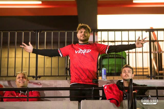 Steve James, core member of Vexed management, poses with his arms outstretched in a Vexed Gaming jersey at the ALGS Split 1 Playoffs 2023.