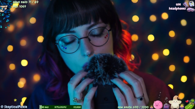 SkepticalPickle doing an ASMR stream tapping on a microphone.