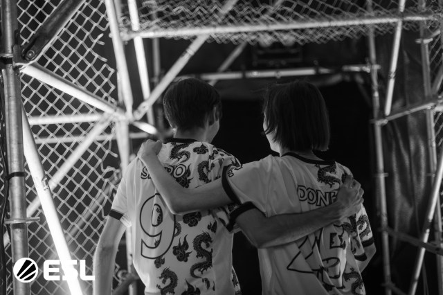 Team Spirit players Donk and sh1ro embrace backstage