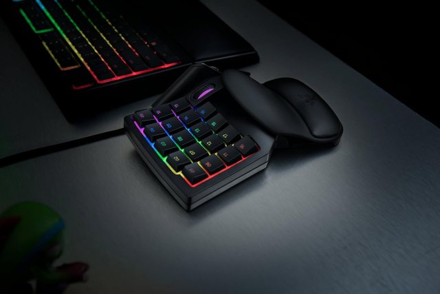 Razer Tartarus V2 one-handed keyboard with wrist rest next to a keyboard