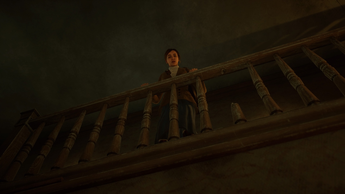 Emily looking over the banister for Edward in Alone in the Dark