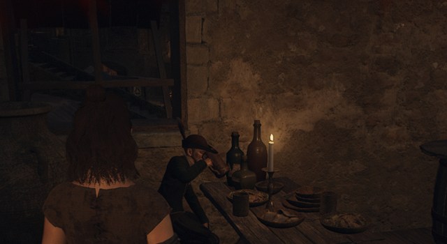 DD2 NPC drinking in an inn.