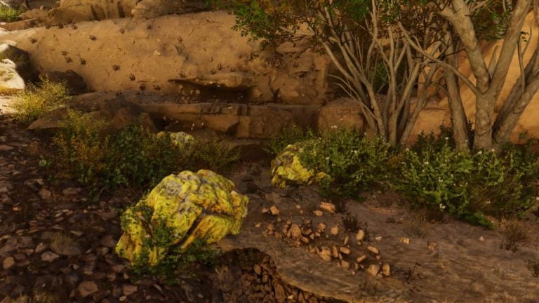 An image showing Sulfur deposits located among foliage on Scorched Earth in Ark: Survival Ascended