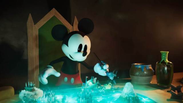 Mickey is playing with a paintbrush in Epic Mickey