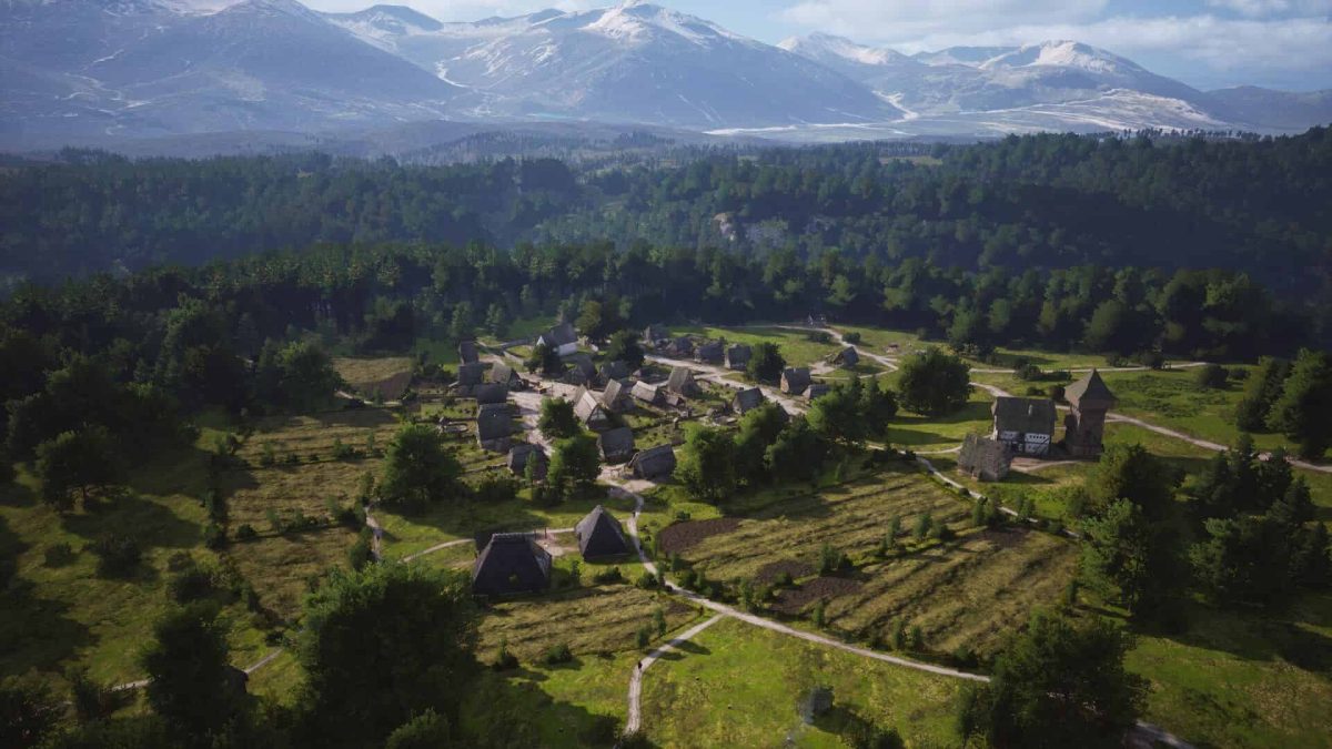 A village in Manor Lords in a wide valley.