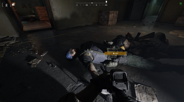 A dead LLA commander in a blue bandanna lies on the floor of a bunker in Gray Zone Warfare.