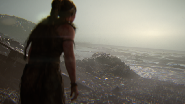 Senua looks tired as she roams a beach