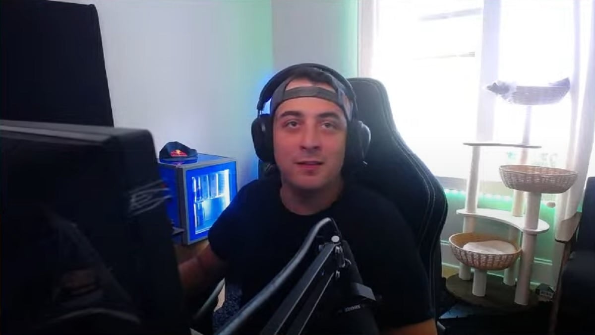 Cloakzy looking at his camera during a stream.