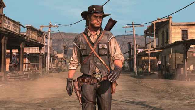 John Marston in RDR1 walking towards the camera wearing generic cowboy drab