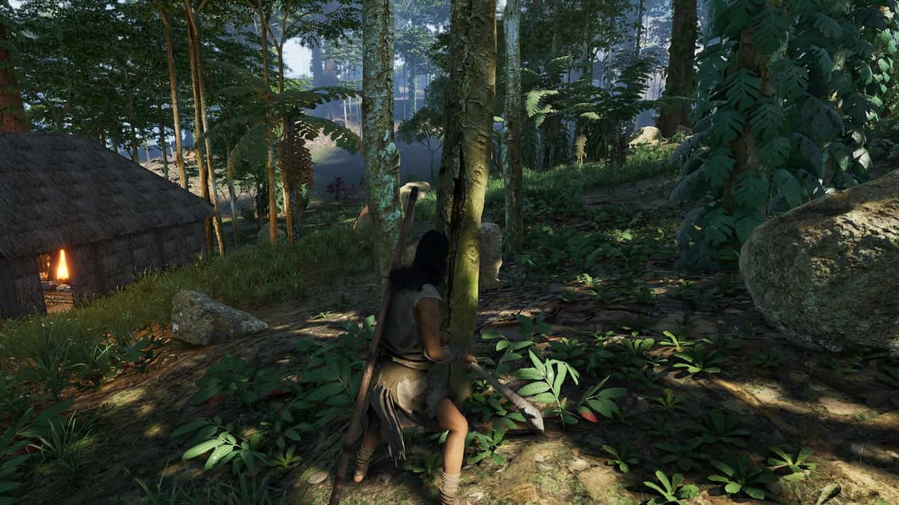 A player in Soulmask chopping down trees in a forest.