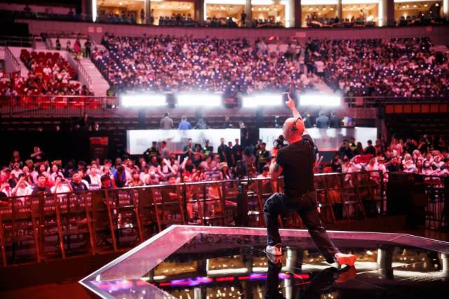 A producer tests a microphone on-stage at MSI 2024.