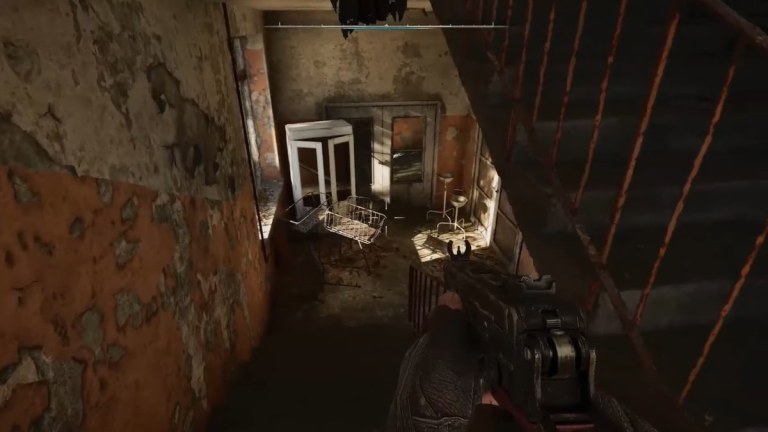 Stalker descending staircase with mini uzi in hand for STALKER 2 trailer