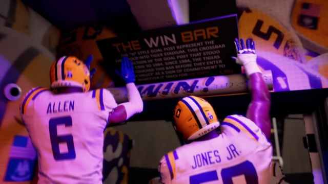 Allen and Jones Jr. on College Football 25 touching then win bar.